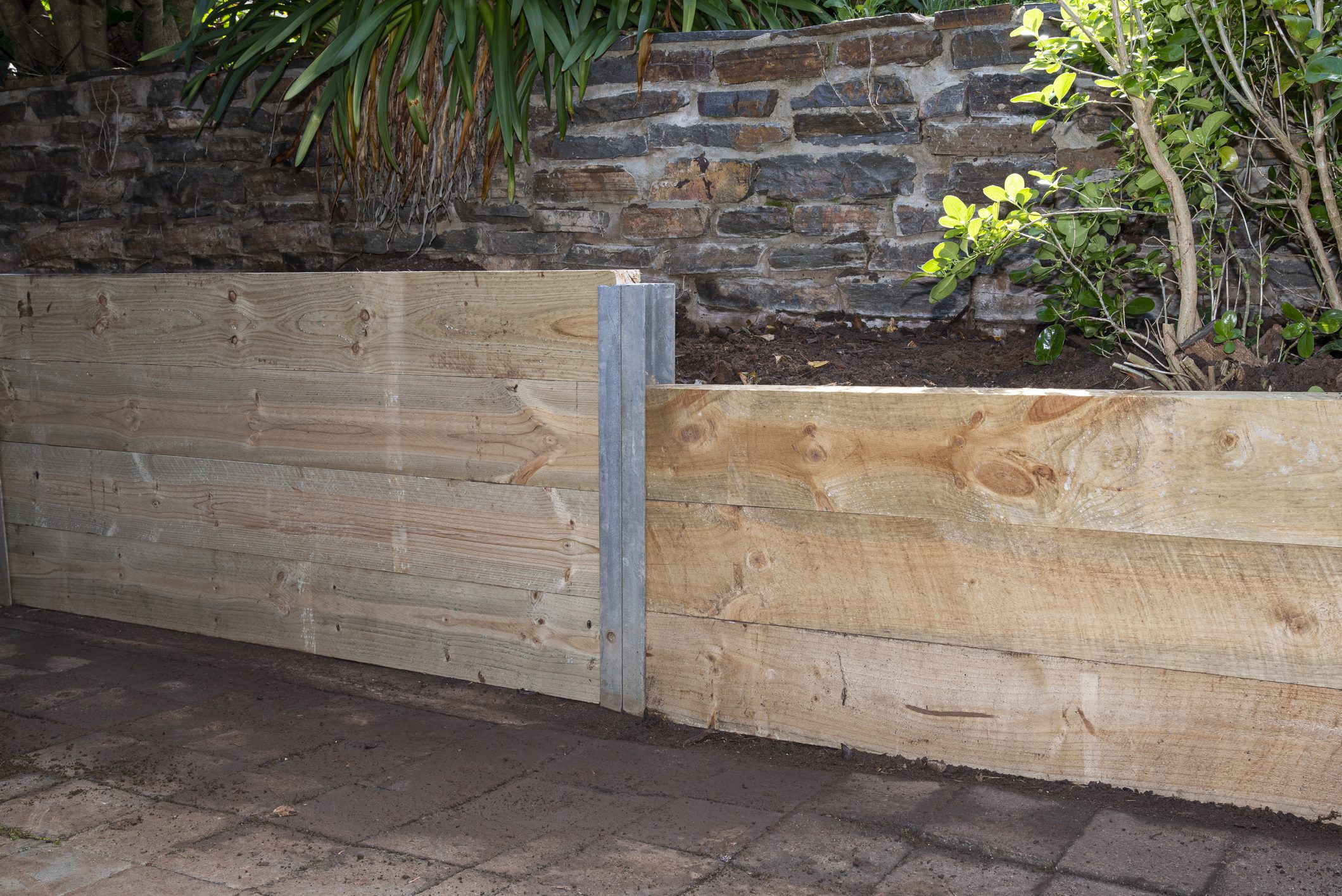 Retaining Wall, bulit with pressure treated Structural Pine, terraced garden beds.